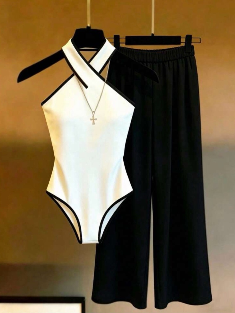 Chic Two-Tone Black & White Halter Bodysuit with Wide-Leg Pants